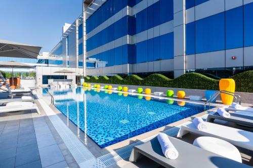 an image of a swimming pool at a hotel at Studio M Arabian Plaza Hotel & Hotel Apartments in Dubai