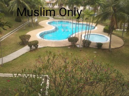 an image of a swimming pool with the words muslin only at Haji Din Cocobay Condo in Port Dickson