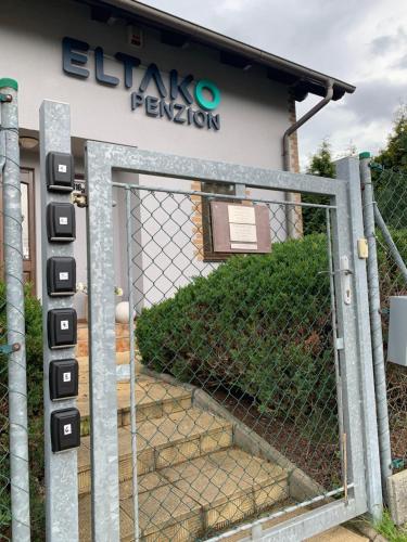 a gate in front of a building at ELTAKO penzion in Karlovy Vary