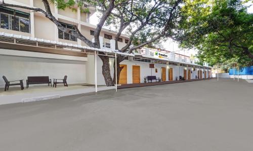 an empty parking lot in front of a building at Itsy Hotels Green Villaa, 2 Km From Pondicherry Railway Station in Puducherry