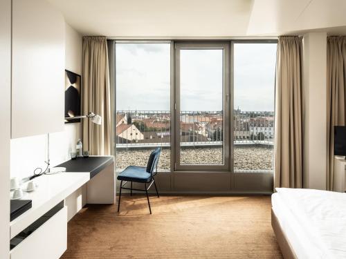 a hotel room with a view of the city at Falkensteiner Hotel Bratislava in Bratislava