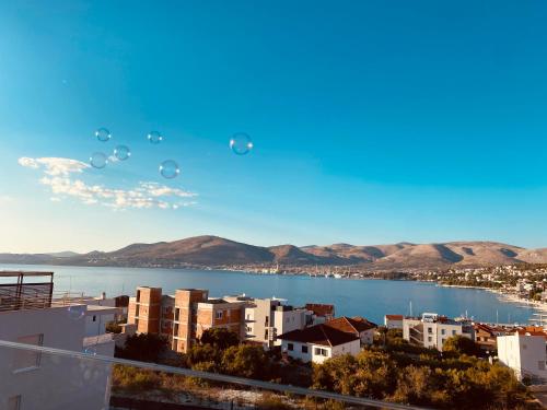 a group of bubbles in the sky over a city at Penthouse Maus in Trogir