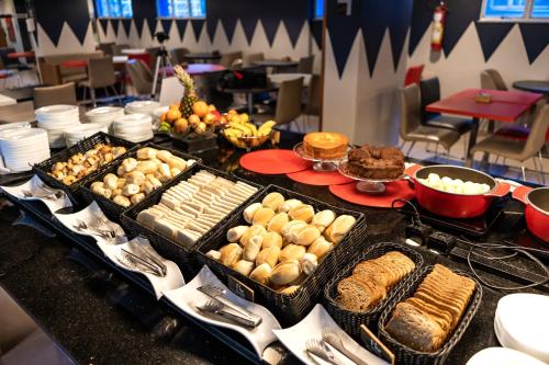 a buffet with many different types of food on a table at ibis Fortaleza Praia de Iracema in Fortaleza
