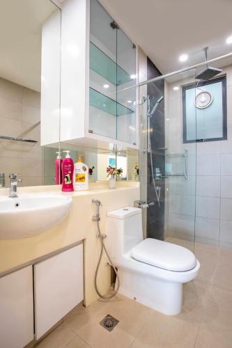 a bathroom with a toilet and a sink and a shower at AJ Suites @ Loft Imago KK in Kota Kinabalu