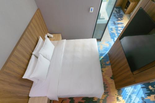 Cama o camas de una habitación en JANDA Golden Tulip Hotel