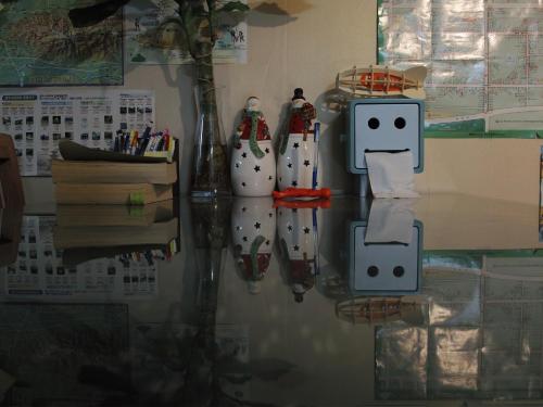 a table with some robots on it on the floor at Gyeongju Momojane Guesthouse in Gyeongju
