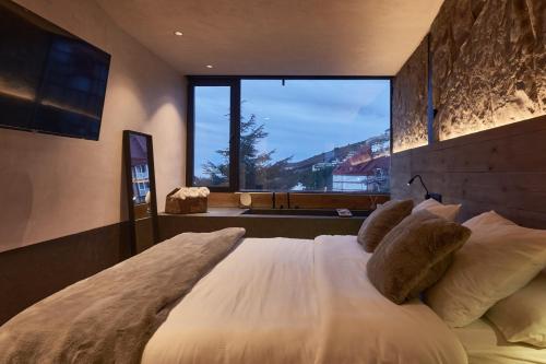 Voodi või voodid majutusasutuse CasaNevada - La mejor casa de Sierra Nevada - Apartamento de lujo toas