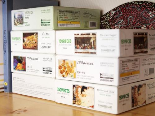 a stack of boxes of food in a store at Gyeongju Momojane Guesthouse in Gyeongju