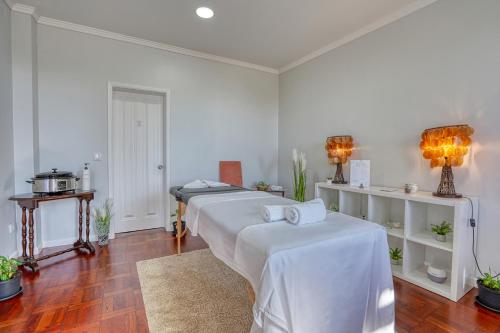 Кровать или кровати в номере Vila Camacho Guest House