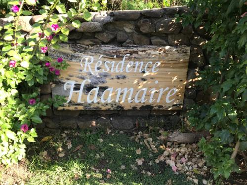 a sign that says resistance hardware on a stone wall at Haamaire in Bora Bora