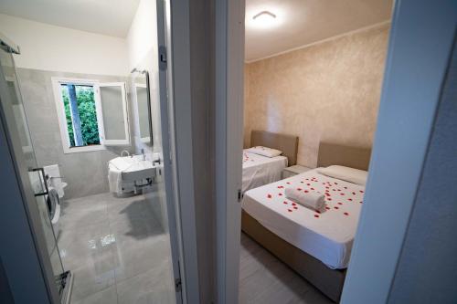 Postel nebo postele na pokoji v ubytování Villetta Jerocades