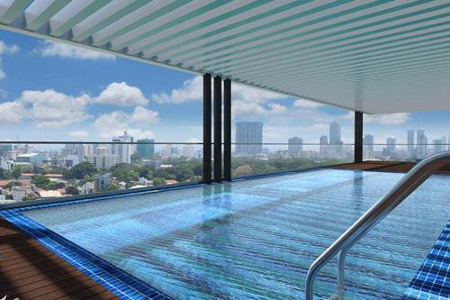 a swimming pool on the roof of a building at Apartment with Pool & Gym in Colombo