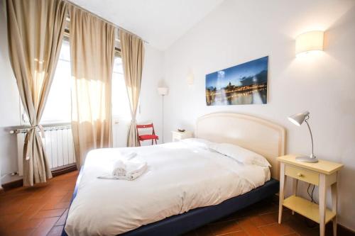 Posteľ alebo postele v izbe v ubytovaní Nice Apartment Near Ponte Vecchio