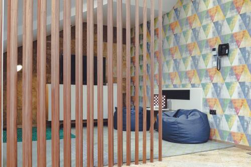 a childs room with a crib with a wall at Holiday Inn Skopje by IHG in Skopje