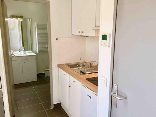 a kitchen with a sink and a counter top at Ma place au sud Aix Parking in Aix-en-Provence