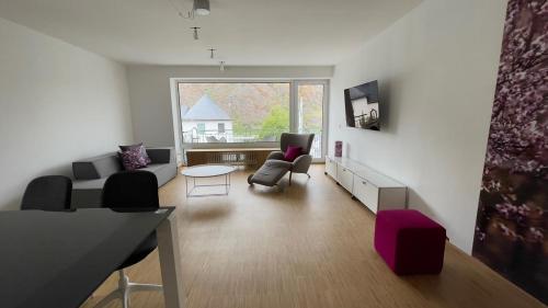 a living room with a couch and a table at Moselfreude in Cochem