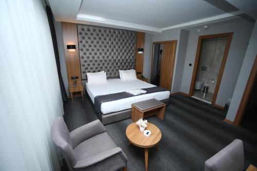 Ένα ή περισσότερα κρεβάτια σε δωμάτιο στο Grand Silay Hotel