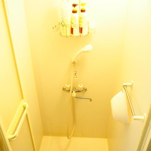 a shower in a bathroom with a toilet at Tokushima GuestHouse【uchincu】 in Tokushima