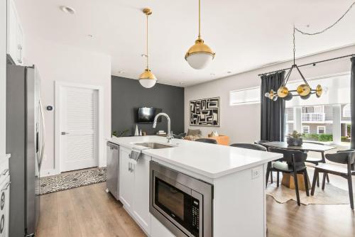 a kitchen with a sink and a counter top at Mason Lofts at West End in Nashville