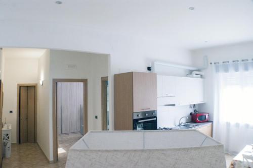 a kitchen with a counter top in a room at Chiara's Home in Brindisi