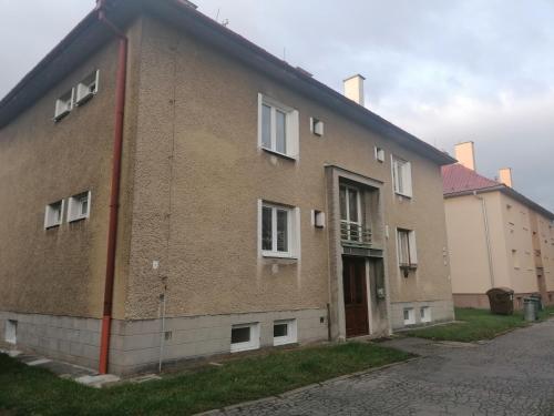 a brick building with a door on the side of it at Apartmán blízko centra v Martine in Martin