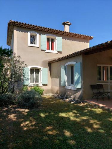 a house with a lawn in front of it at Fayence Villa with private pool in Fayence