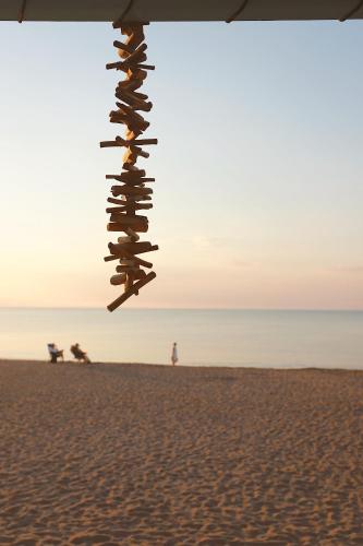 a group of shoes hanging on the beach at Hotel Noguera Mar in Denia