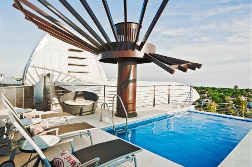 a swimming pool on the deck of a yacht at Senator Banus in Estepona