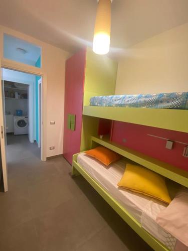 a bedroom with two bunk beds and a hallway at IL QUADRIFOGLIO in Castellammare di Stabia
