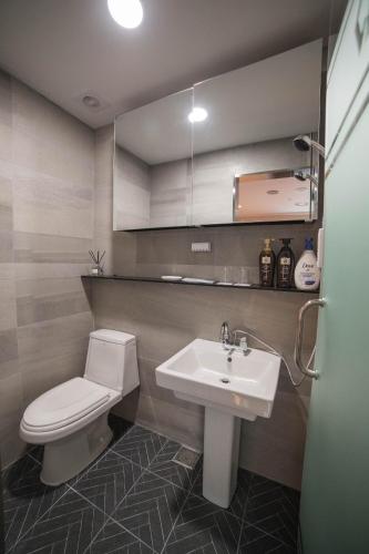 a bathroom with a toilet and a sink at Calistar Hotel in Seoul