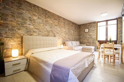 Postel nebo postele na pokoji v ubytování Iris Ortigia Apartments