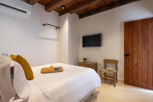 Cama o camas de una habitación en Hotel Voilá Getsemaní