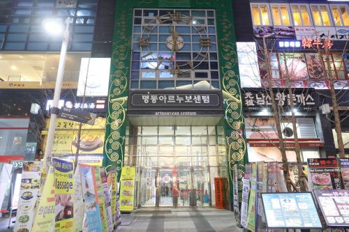 a building with a clock on top of it at Calistar Hotel in Seoul