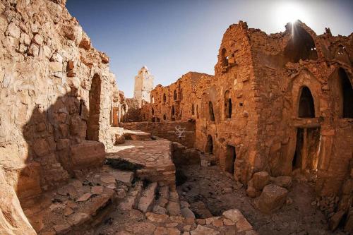 an alley way in an old stone building at Hotel Pansy in Ksar Ghilane