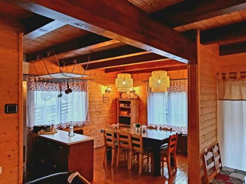 a dining room with a table and chairs in a house at Old Mark's House Sinaia in Sinaia