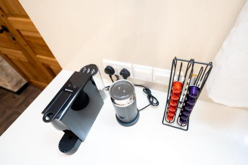 a table with a hair dryer and other items on it at Palazzino Luxury Suites in Lofou