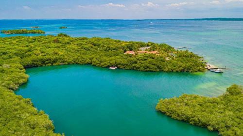 an aerial view of a small island in the water at Hotel Cocoliso Island Resort in Isla Grande