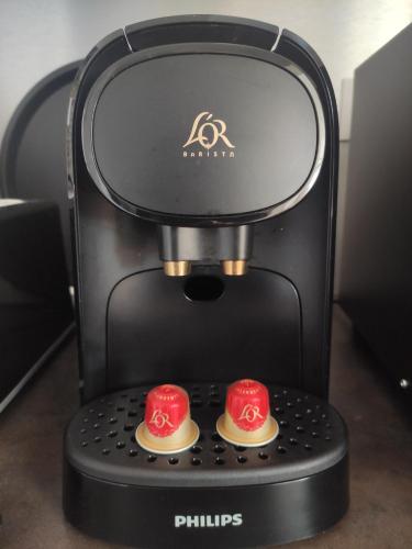 a black and red coffee maker with two red cups at LE WELCOME vue port appartement plain pied in Fécamp
