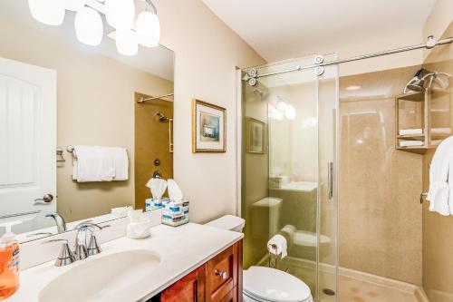 a bathroom with a sink and a shower at Menorca Court in Marco Island