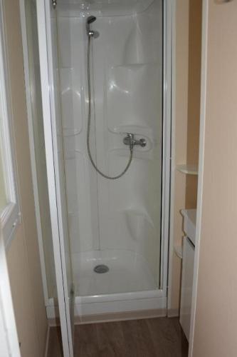 a shower with a glass door in a bathroom at PARADIS-ZEN in La Roque-dʼAnthéron