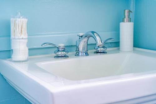a bathroom sink with a silver faucet on it at The Estate at Mt Dora in Mount Dora