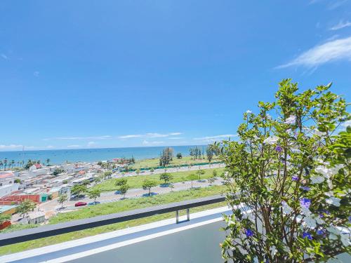 a view of a parking lot and the ocean at Lam's Beach Homestay in Phan Thiet