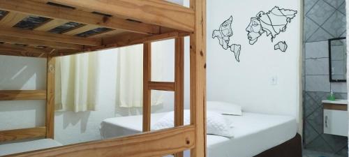 a bunk bed in a room with a mirror at Chácara Sorriso 1 em Atibaia in Atibaia