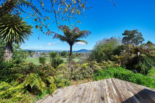 a view from the roof of a house with trees at Luigi's apartment in Rotorua