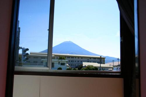 a view of a mountain from a window at レトロ in Azagawa