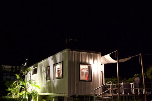 a tiny house is lit up at night at Vacation Village Okinawa - Nakijin in Nakijin