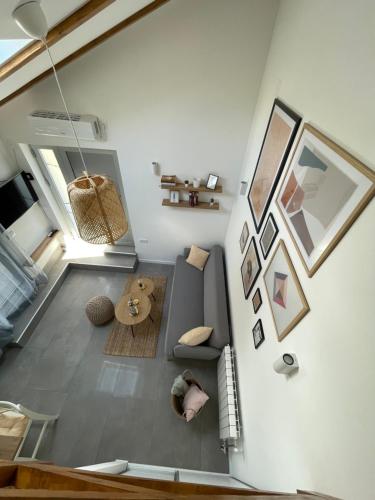 a living room with a couch and a teddy bear at Residence Provence New in Vrdnik