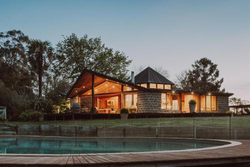 a house with a pool in front of it at Kangaroo Manor in Yarra Junction