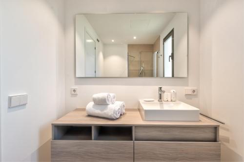 a bathroom with a sink and a mirror at Jardines - Tabor 2 1 POOL VIEW 2B in Palm-Mar