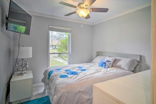 a bedroom with a bed and a ceiling fan at Family-Friendly Baton Rouge Abode with Patio! in Baton Rouge